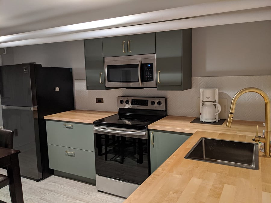 Renovated full kitchen (fridge, microwave, electric stove, dishwasher, and coffee maker). Dishware and cookware are included.