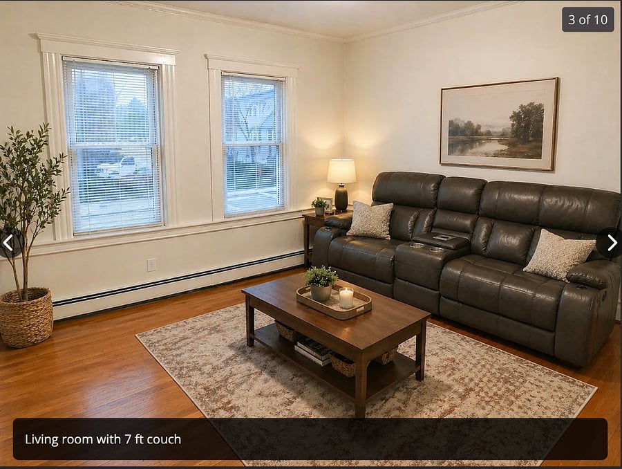 Double reclining sofa w adjustable headrest and middle is also a tray w plugs lights and cupholders