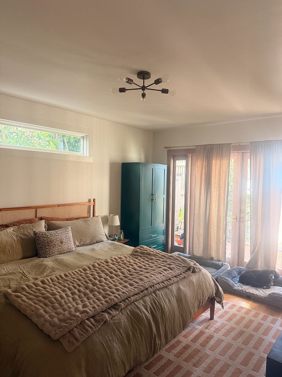 primary bedroom with king size bed and ensuite bathroom