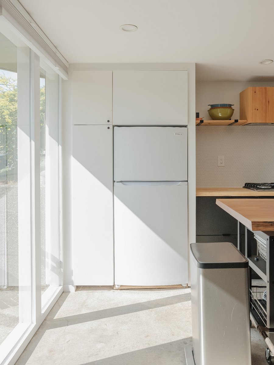 Full size fridge and large pantry area