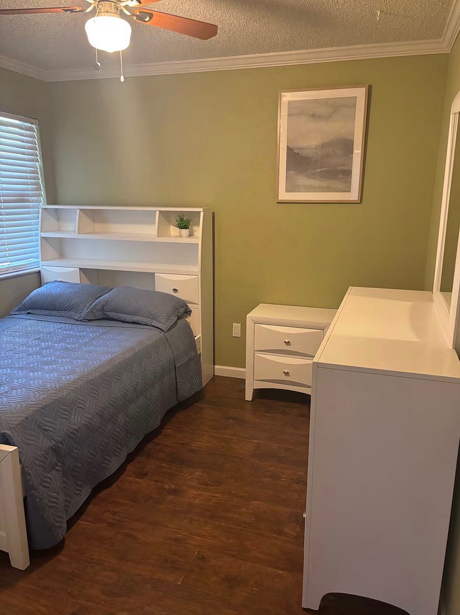 Bedroom 3 with full-size bed, dresser, and nightstand cozy and practical.