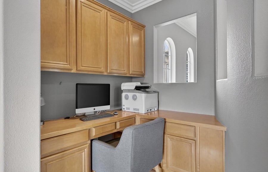Upstairs den features a large dedicated desk and workspace, ideal for working from home, remote meetings, or focused study in a quiet, comfortable setting, along with a comfortable sofa for lounging and relaxation.