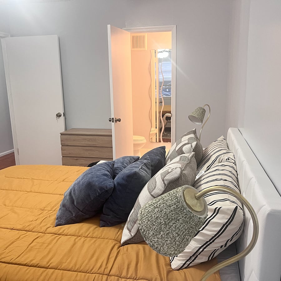 Master bedroom with half a bathroom.