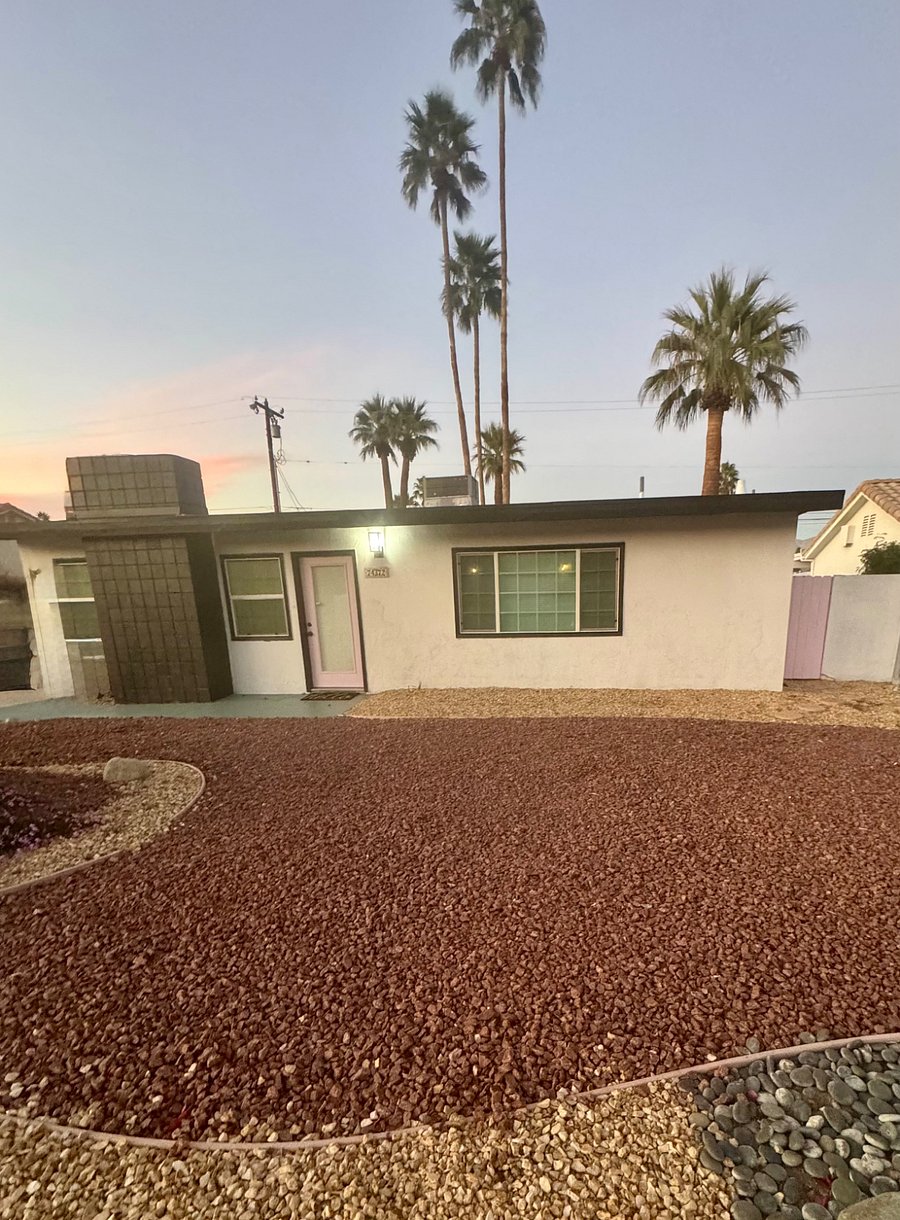 Beautiful desert landscaping and mature palm trees adorn the property 