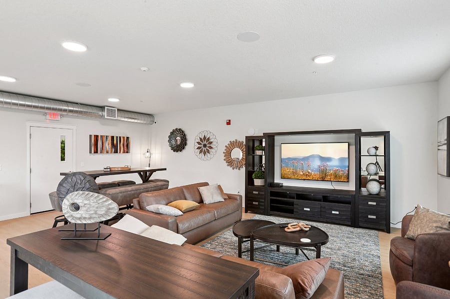 Community lounge with oversize, leather furniture and TV. You can use your own Firestick/Roku on the TV. Reservable space for gatherings.