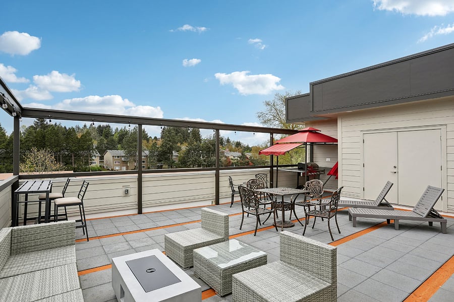 Roof-top patio with seating, propane coffee table, propane heater and a propane grill for use.