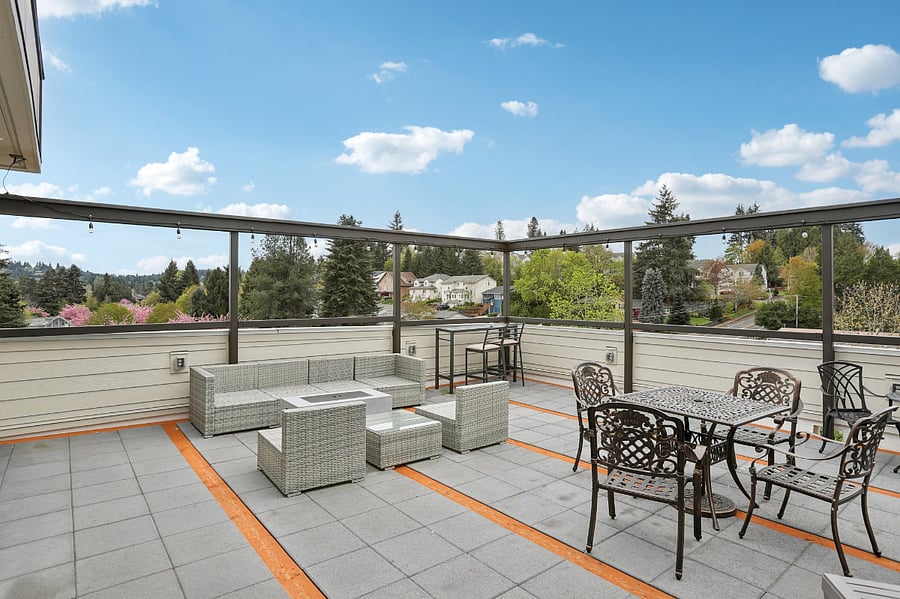 Roof-top patio with seating, propane coffee table, propane heater and a propane grill for use.