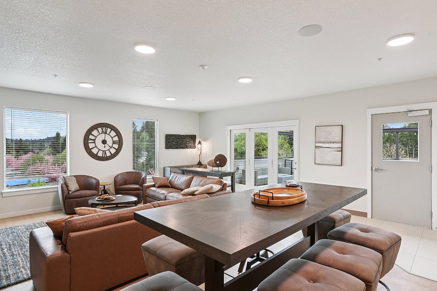 Community lounge with oversize, leather furniture and TV. You can use your own Firestick/Roku on the TV. Reservable space for gatherings.