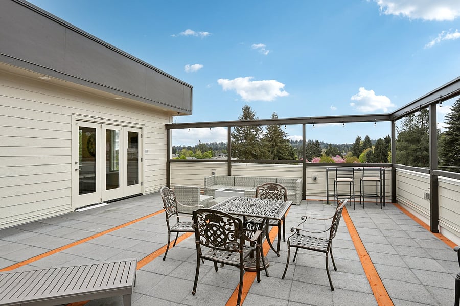 Roof-top patio with seating, propane coffee table, propane heater and a propane grill for use.