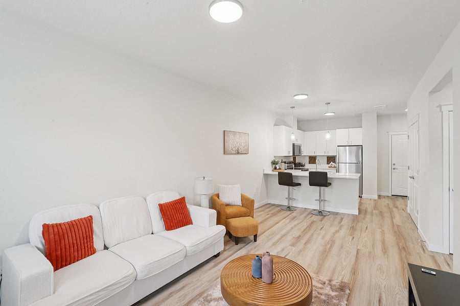 Living space with sofa and coffee table - TV will be provided.