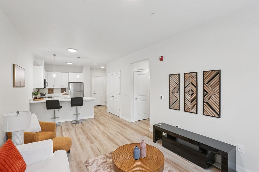 Living space with sofa and coffee table - TV will be provided.