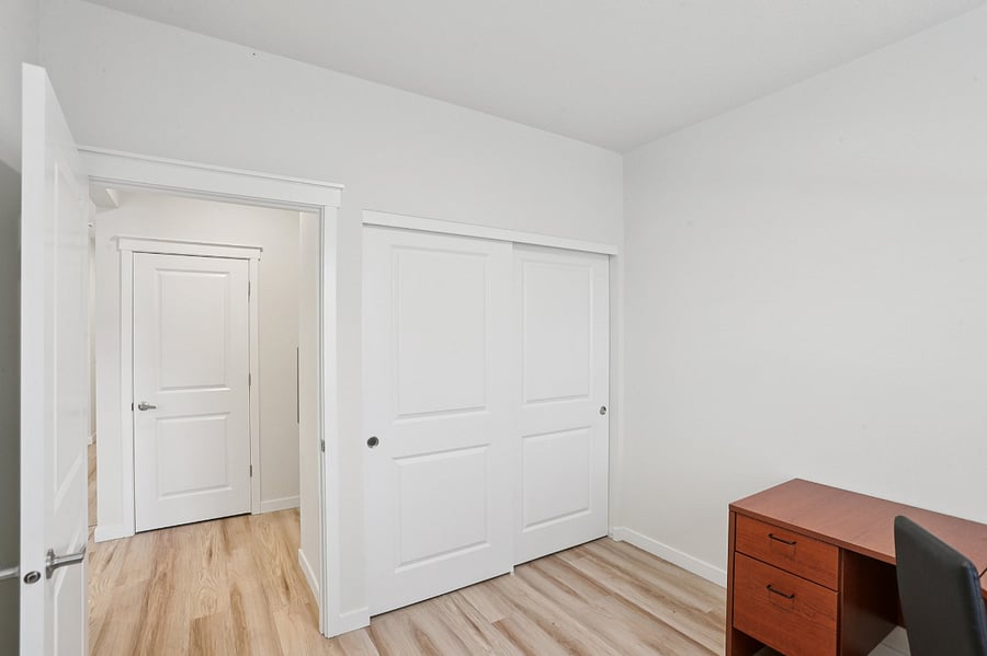 Secondary bedroom. Can be furnished as an office or additional bedroom with dresser and full size bed.