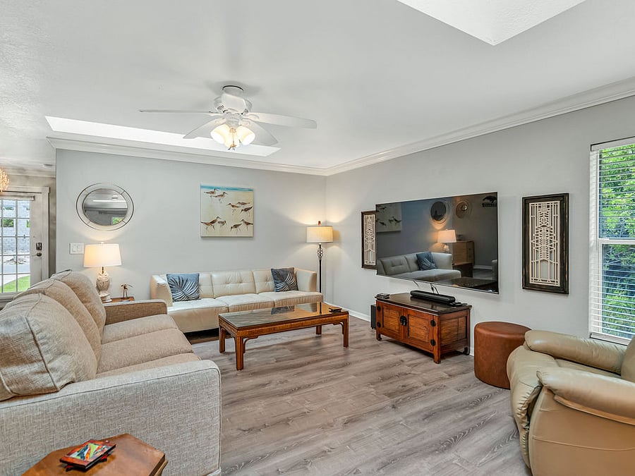 Bright and airy living room space, multiple skylights. Put your feet up & relax!