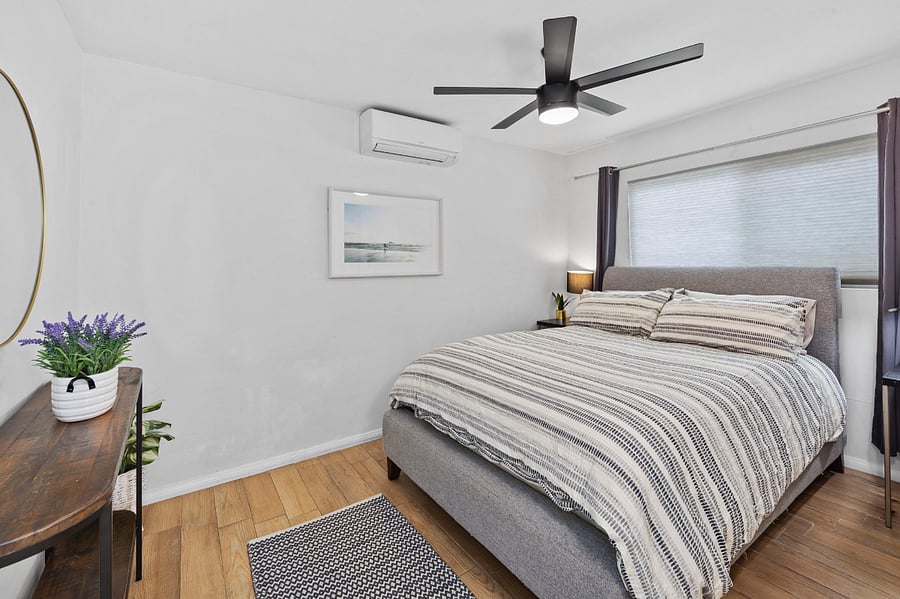 Bedroom 1 with independent AC and blackout curtains