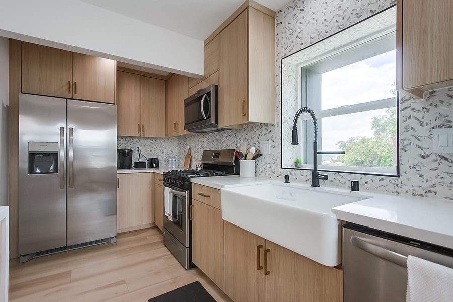 Fully equipped kitchen with modern appliances, generous counter space, and all the essentials needed to cook and feel at home