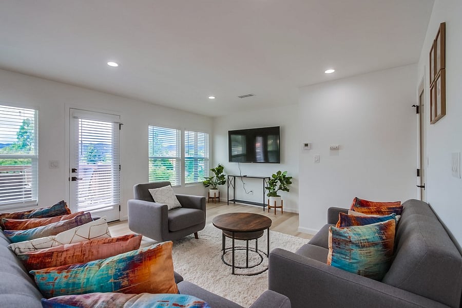 Comfortable living room designed for relaxation, featuring a bright open layout and cozy seating for movie nights or quiet evenings