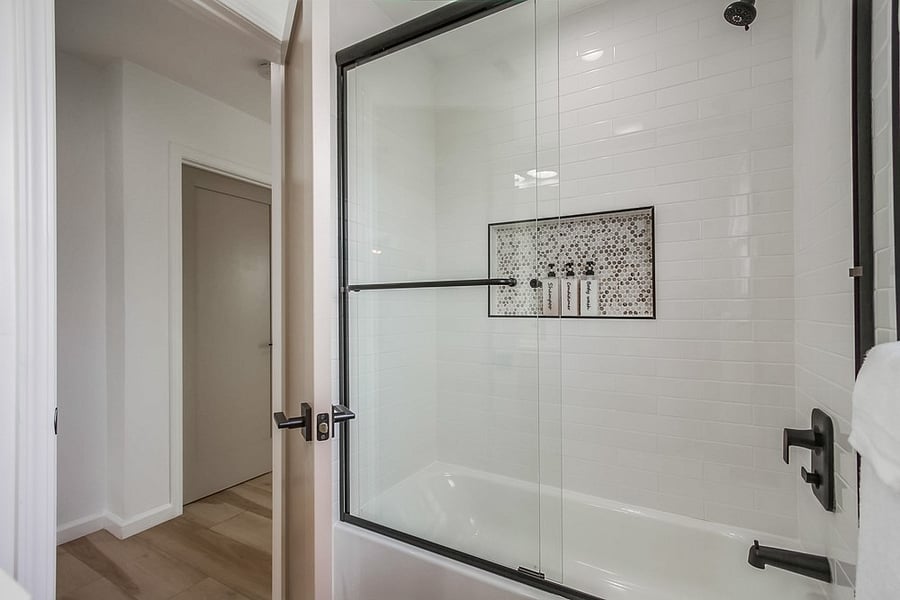 Fresh and updated full bathroom conveniently located near guest bedrooms for added comfort and privacy.