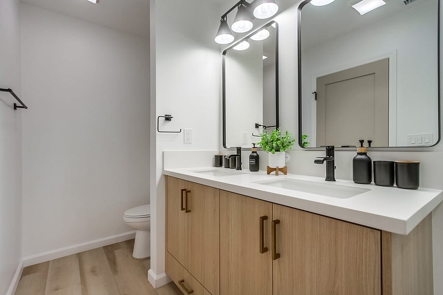 Private primary bathroom with a clean modern design, spacious vanity, and everything needed for a comfortable daily routine