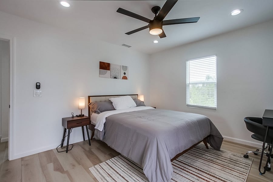 Bright and cozy guest bedroom thoughtfully furnished for comfort, making it ideal for family members, roommates, or visiting guests.