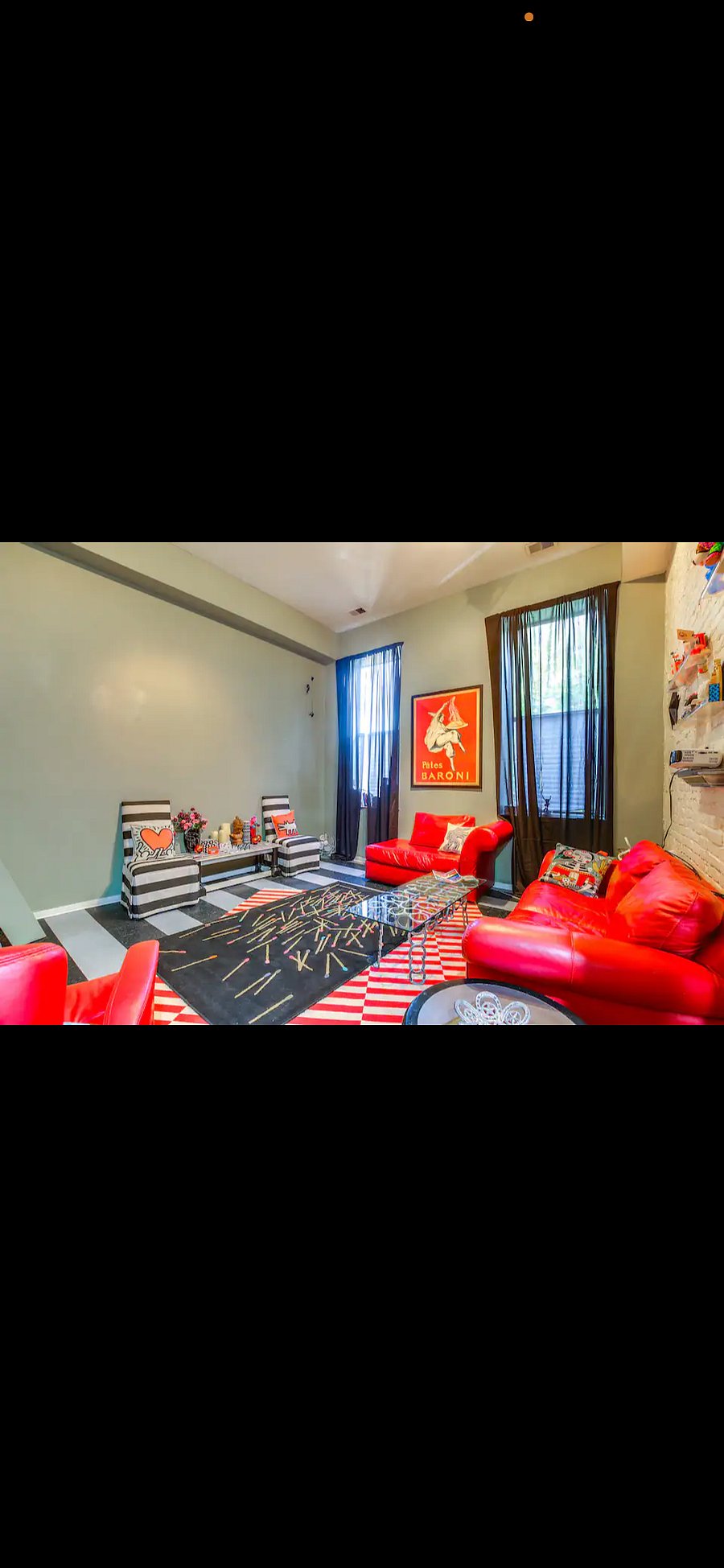 That big blank wall is for your 14ft projector tv screen, those red couches are Natuzzi, glove soft leather. They just engulf you when you sit in them. This living room is made for the ultimate in relaxing. Every night you are out to the movies! There are plenty of books, a chess set, board games and even a view master for you to see Saint Louis in the early years of the 50s and 60s. See another one if our tictok page Watch the full video now! https://www.tiktok.com/t/ZTBR3GWJE/