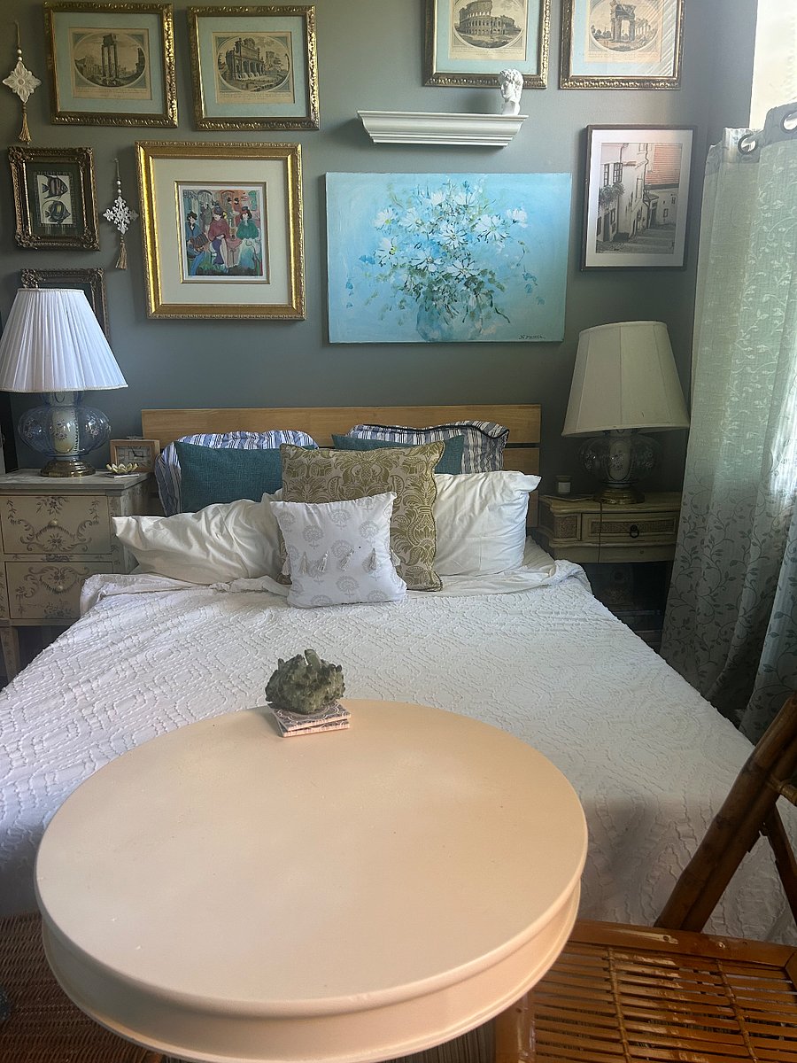 This is the main bedroom, Its done in peaceful, blues and greens. It has a queen size bed and a theater screen Projector TV. All you need is an HDMI device