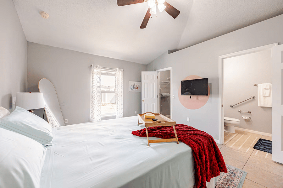 There is a walk-in closet and bathroom