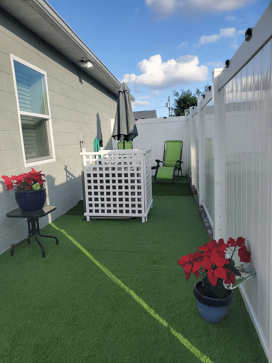 Patio which is accessed through the garden gate.