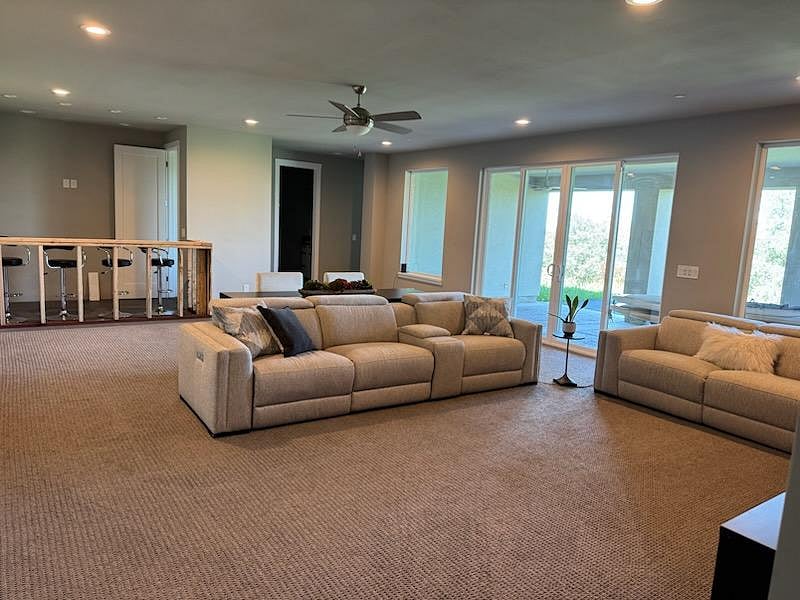 Living space has sliding doors leading to large & private covered patio