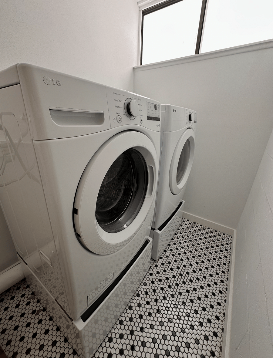 New Full size LG washer and drawer, located directly outside front door.