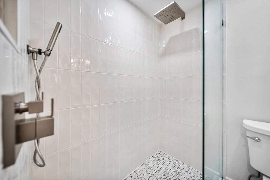 Walk in shower with rain head, and hand held for convenience.