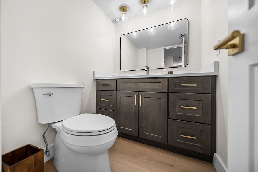 Large half bath located off kitchen.