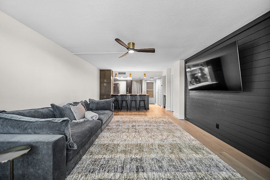 Living room with overhead fan with remote.