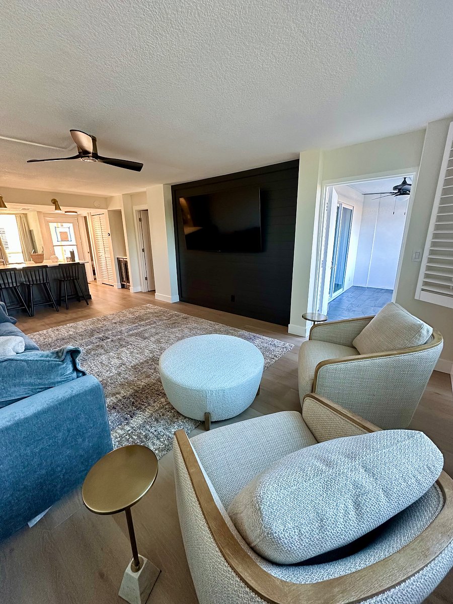 Living area with 65" Smart TV, and seating area.
 