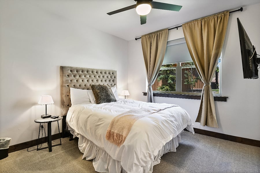 Bedroom 4: with comfy Queen bed, TV, and ensuite bath - Middle/Main Floor
