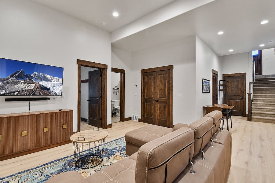 Spacious den with large pullout sofa TV, games, and bathroom