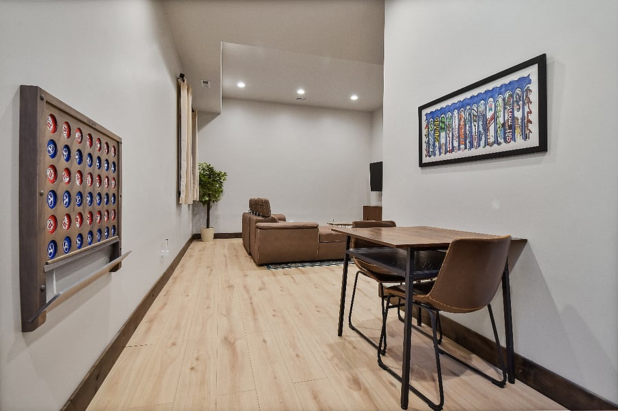 Spacious den with large pullout sofa TV, games, and bathroom