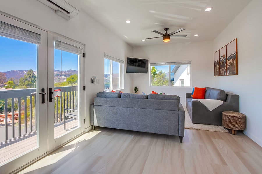 Comfortable living room designed for relaxation, featuring a bright open layout and cozy seating for movie nights or quiet evenings