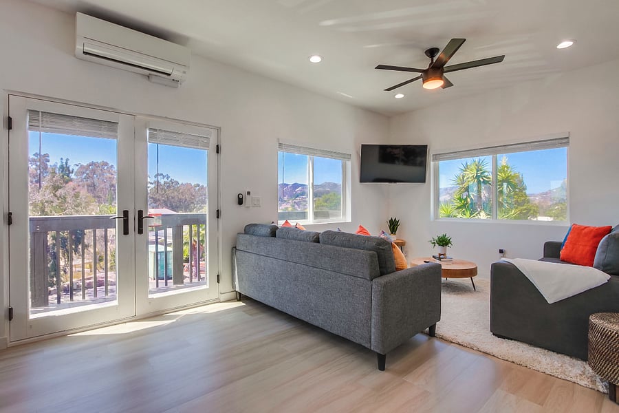 Comfortable living room designed for relaxation, featuring a bright open layout and cozy seating for movie nights or quiet evenings