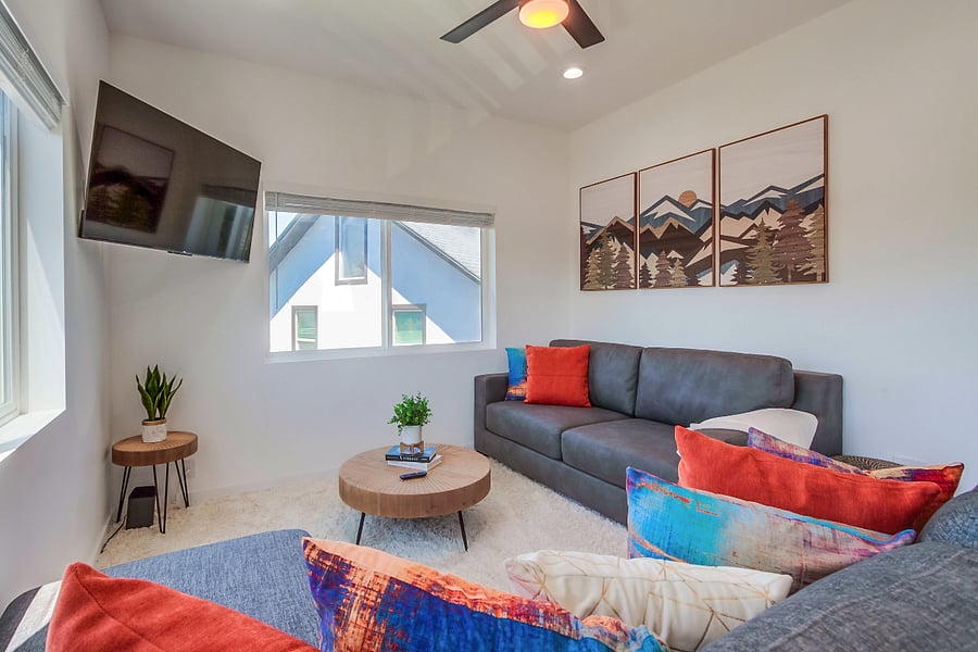 Comfortable living room designed for relaxation, featuring a bright open layout and cozy seating for movie nights or quiet evenings