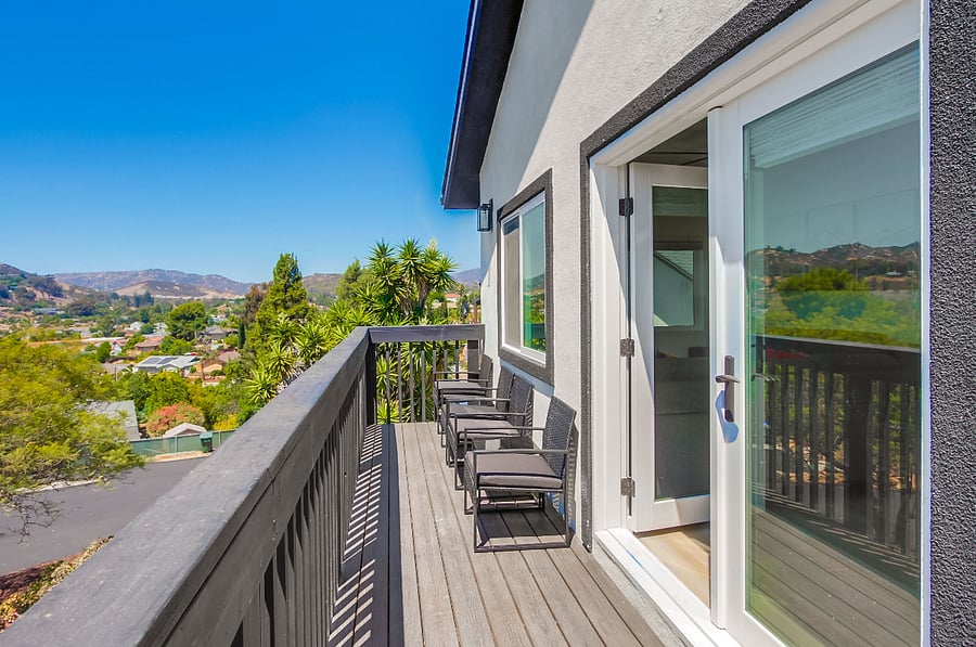 Private patio with scenic elevated views and outdoor seating, offering a calm and comfortable space to recharge during your stay