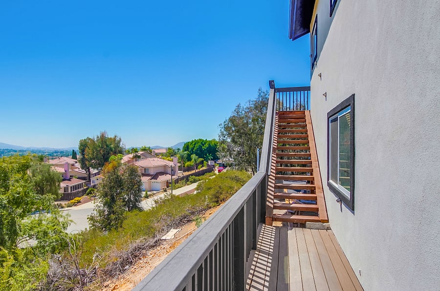 Stairs to theThoughtfully equipped kitchen featuring dishes, cookware, utensils, small appliances, and essential household supplies to make move-in easy and stress-free house