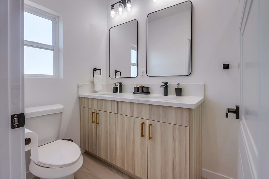 Private primary bathroom with a clean modern design, spacious vanity, and everything needed for a comfortable daily routine