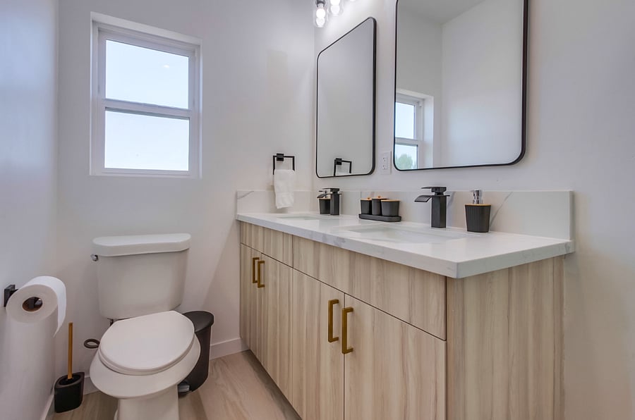 Private primary bathroom with a clean modern design, spacious vanity, and everything needed for a comfortable daily routine