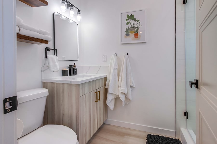 Fresh and updated full bathroom conveniently in the second bedroom for added comfort and privacy