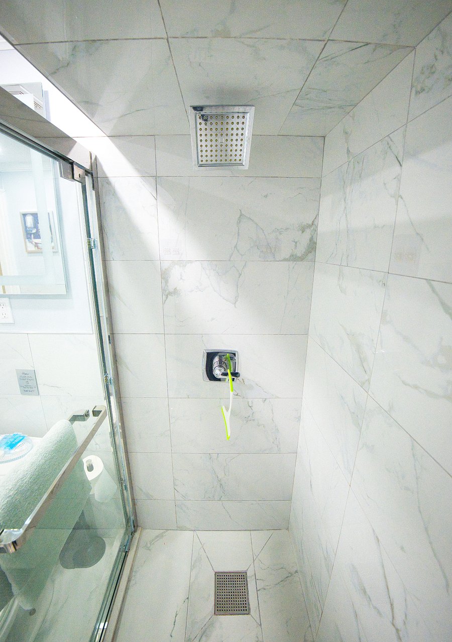 This is the full-sized shower designed for comfort and relaxation, offering a refreshing space to unwind and recharge after a long day of exploring or traveling.