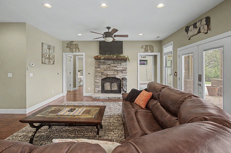 living room looking at both bedroom entrances and fireplace