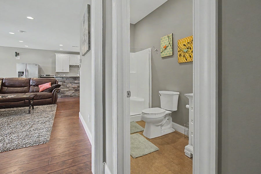 looking into living room from bedroom 1 and into bathroom 1