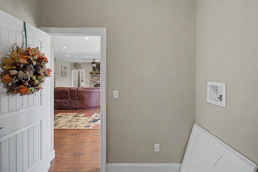 Laundry room looking into living room