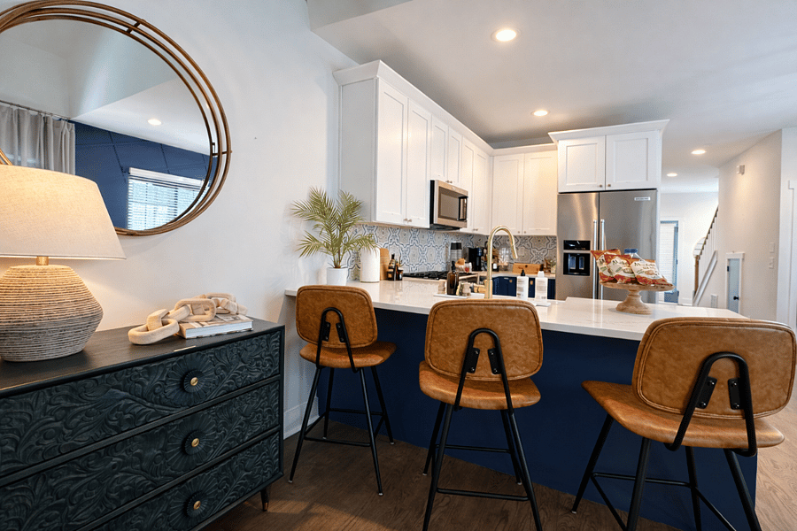 The island seats 3 with extra dining space for easy gatherings.
