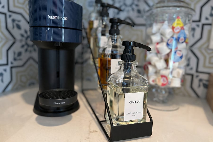 Luxe espresso bar equipped for coffee, espresso, or tea. Snack bar stocked with cookies and tea treats, plus honey, creams, and sweeteners to elevate every luxurious cup of sunshine.